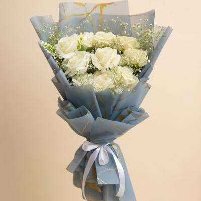 Elegant White Roses Bouquet with Blue & Gold Marble Wrap